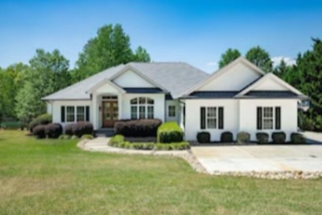 Sold four-bath home with a landscaped circular walk at 166 South Oak Pointe Drive in Seneca, South Carolina