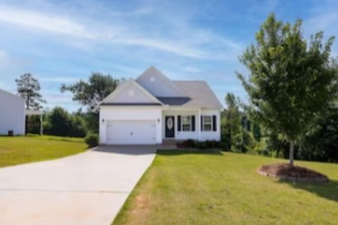 Home with an attached garage and open front lawn at 768 Rocky Ridge Circle in Seneca, South Carolina