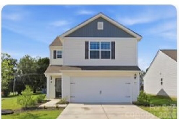 Two-story home with an attached garage at 305 Aniston Lane in Shelby, North Carolina